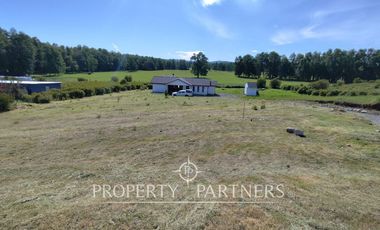 Hermosa parcela con casa en condominio.