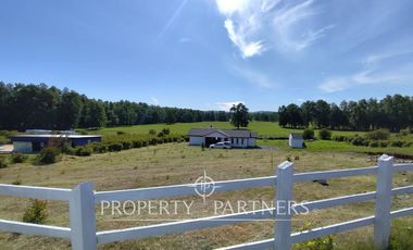 Hermosa parcela con casa en condominio.