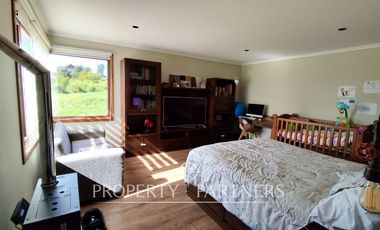 Hermosa parcela con casa en condominio.