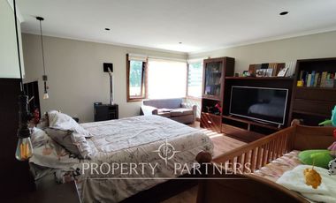 Hermosa parcela con casa en condominio.