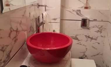 Departamento tipo piso cuatro ambientes con cochera a la venta en Avellaneda Centro