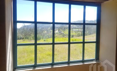 CASA Y TERRENO DE VENTA ZHIDMAD AZUAY