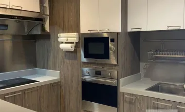 Modern dark-toned condo with glass dining at Royal Castle (AA44283)