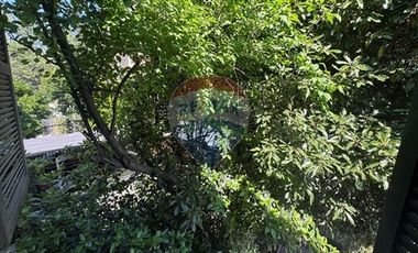 Casa de dos pisos y manzarda