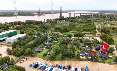 Casa en barrio privado Yacht Club Guazú. De 5 Ambientes. 800 m2 totales. Frente al Río Paraná Guazú.