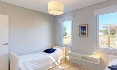 Casa en venta en Costa Esmeralda con fondo libre arbolado