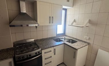 Departamento con tres habitaciones, dos baños, cochera, cocina, living comedor, balcón.-