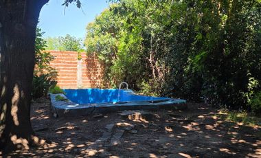 Casa sobre dos terrenos