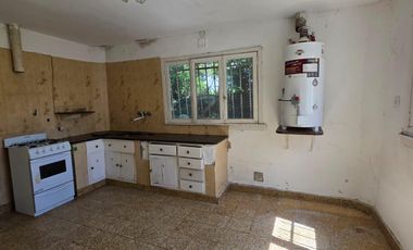 Casa sobre dos terrenos