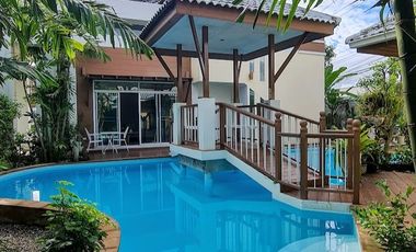 Lanna style pool villa with garden