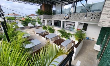 Oportunidad Única en Playa del Carmen: Edificio Comercial con Hostal y Roof Top Bar