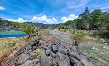 VENDO LOTE DE 1100M2 TITULADO COLINDANTE CON RIO CALDERA
