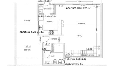 Casa en construcción y quincho terminado.