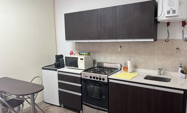 Departamento monoambiente con balcón y cochera en venta en Martinez