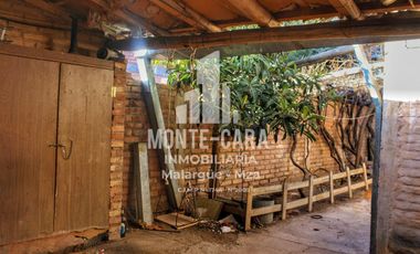 Casa más departamentos en construcción