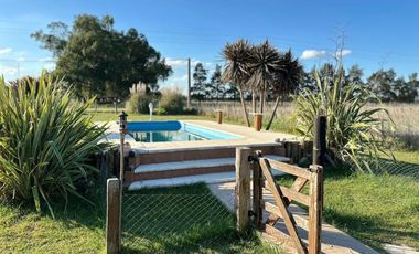 VENTA CASA 2 AMBIENTES C/ PARQUE Y PILETA EN MONTE