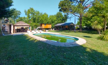 Gran terreno de 1.200m² con casa, quincho y pileta