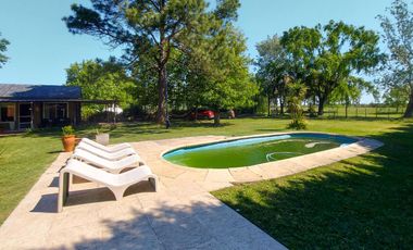 Gran terreno de 1.200m² con casa, quincho y pileta