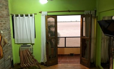 VENDO CASA SOBRE LA COSTA DEL RIO EN AVD ESTRADA