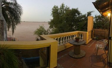 VENDO CASA SOBRE LA COSTA DEL RIO EN AVD ESTRADA