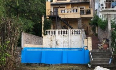 VENDO CASA SOBRE LA COSTA DEL RIO EN AVD ESTRADA