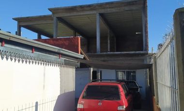 Merlo  lote de 10x27,50 con dos casas, precio total:  U$S 90.000