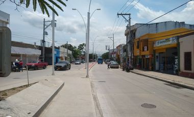 ESDIFICIO CON DOS LOCALES COMERCIALES Y TRES APARTAMENTOS.