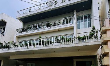 4BR Semi-furnished House with a Garden and Roof deck in Mahogany Place 3, Acacia Estates, Taguig City