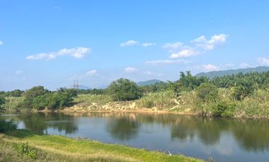 Almost 10 rai along the canal with a mountain view is land for sale in Takua Pa, Phang Nga.