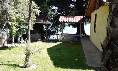 PARCELA CON CASA A ORILLA DE LAGO RAPEL