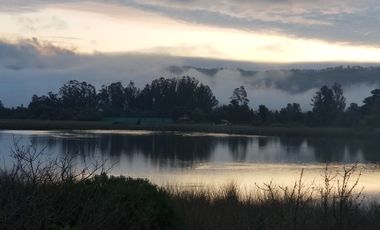 EXTRANJERO POR VIAJE VENDE CASA FRENTE A LAGUNA TORCA - MARAVILLOSO TERRENO