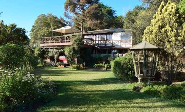 EXTRANJERO POR VIAJE VENDE CASA FRENTE A LAGUNA TORCA - MARAVILLOSO TERRENO