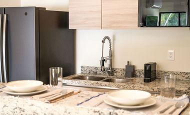 Departamento en venta en Puerto Morelos con Albercas, Gimnasio y Seguridad