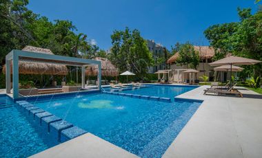 Departamento en venta en Puerto Morelos con Albercas, Gimnasio y Seguridad