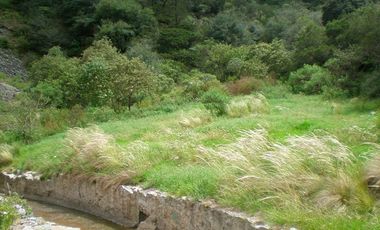 Terreno de 11 Hectáreas a Pie de Carretera Pachuca - Huejutla, cuenta con permiso de uso turístico y piscícola.
