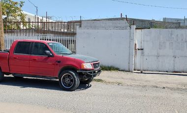 TERRENO CON CONSTRUCCION EN RENTA