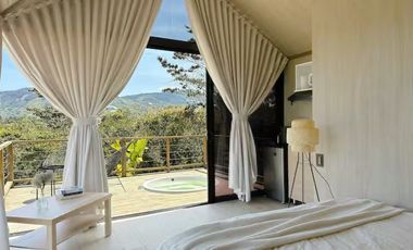 Venta lote con 2 cabañas, (AIrbnb)