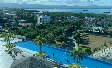 FOR RENT - 1BEDROOM WITH BALCONY FRONT SEA & POOL VIEW IN MACTAN NEWTOWN, LAPU-LAPU CEBU. POLISHED & MODERN UNIT.