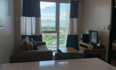 FOR RENT - 1BEDROOM WITH BALCONY FRONT SEA & POOL VIEW IN MACTAN NEWTOWN, LAPU-LAPU CEBU. POLISHED & MODERN UNIT.