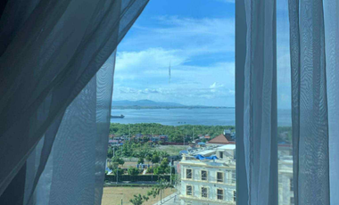 FOR RENT - 1BEDROOM WITH BALCONY FRONT SEA & POOL VIEW IN MACTAN NEWTOWN, LAPU-LAPU CEBU. POLISHED & MODERN UNIT.