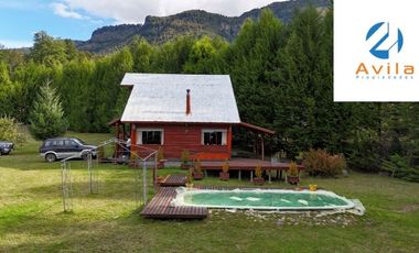 Curarrehue sector Caren parcela de 5.100m2 con casa y piscina a un costado carretera COD.VTAP224