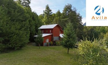 Curarrehue sector Caren parcela de 5.100m2 con casa y piscina a un costado carretera COD.VTAP224