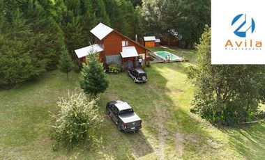 Curarrehue sector Caren parcela de 5.100m2 con casa y piscina a un costado carretera COD.VTAP224