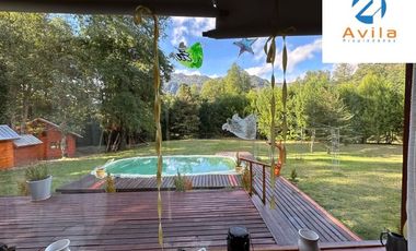 Curarrehue sector Caren parcela de 5.100m2 con casa y piscina a un costado carretera COD.VTAP224