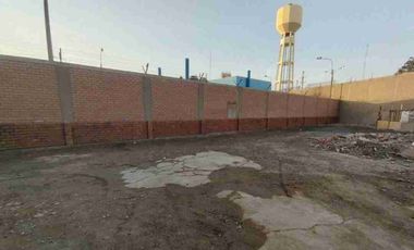 Terreno cercado zonificación O.U. de 1,709 m2, con portón metálico, colinda con Almacén Central de Ransa, Sedapal, Penal Sarita y AA HH Acapulco