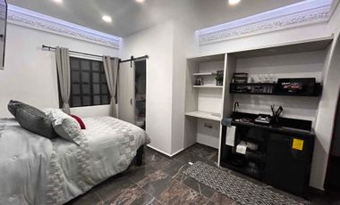 Suite con baño privado barra de cocina y lavadora