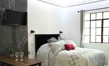 Suite con baño privado barra de cocina y lavadora