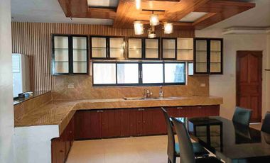 Single detached house with 6 bedrooms semi furnished inside Subd