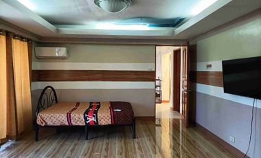 Single detached house with 6 bedrooms semi furnished inside Subd