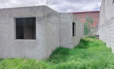 TERRENO CON CASA EN OBRA NEGRA EN PACHUQUILLA